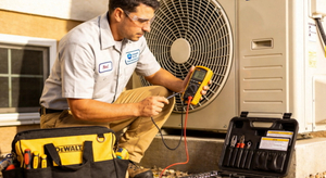 HVAC Technician Performing Air Conditioner Maintenance.jpg