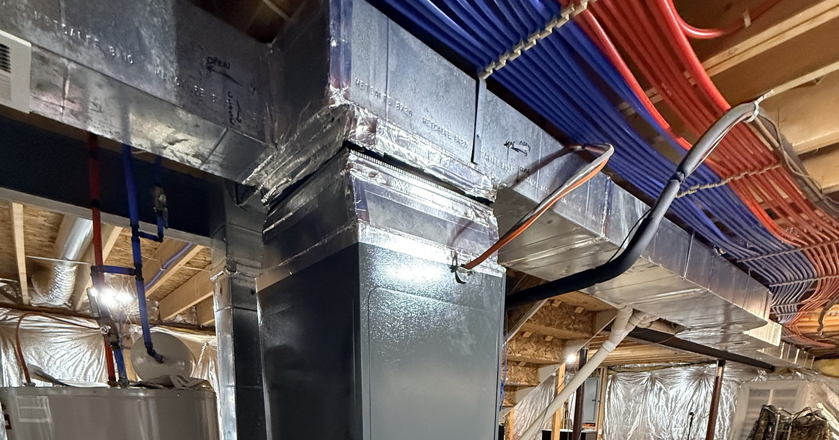 Clean Mechanical Room Layout With Proper Drainage Setup.jpeg