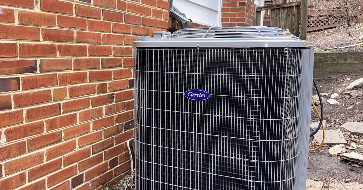 Modern Carrier Outdoor Condenser On Level Support Pad.jpg